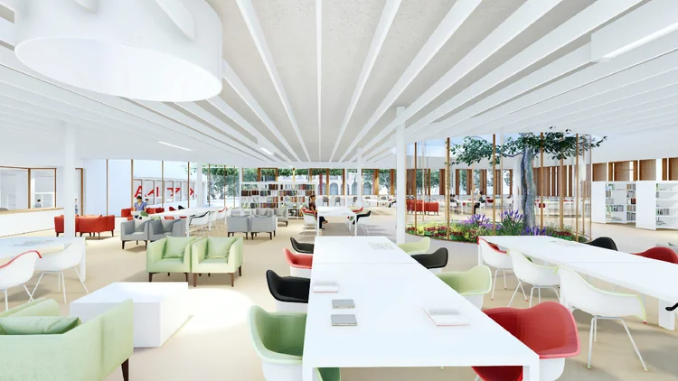Prototip de l'interior de la nova biblioteca, amb taules blanques i cadires de colors